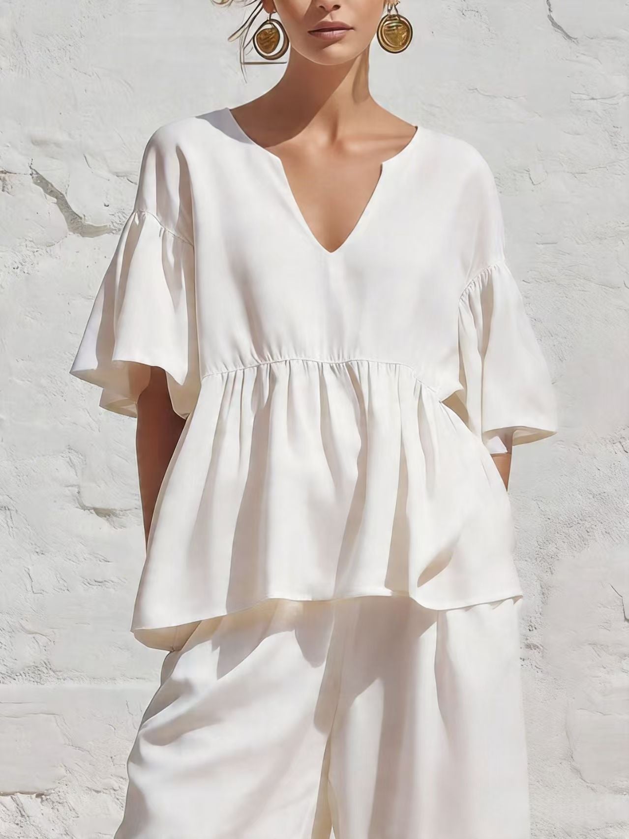 Relaxed Ruffle Hem Blouse with V-Neckline and Flutter Sleeves