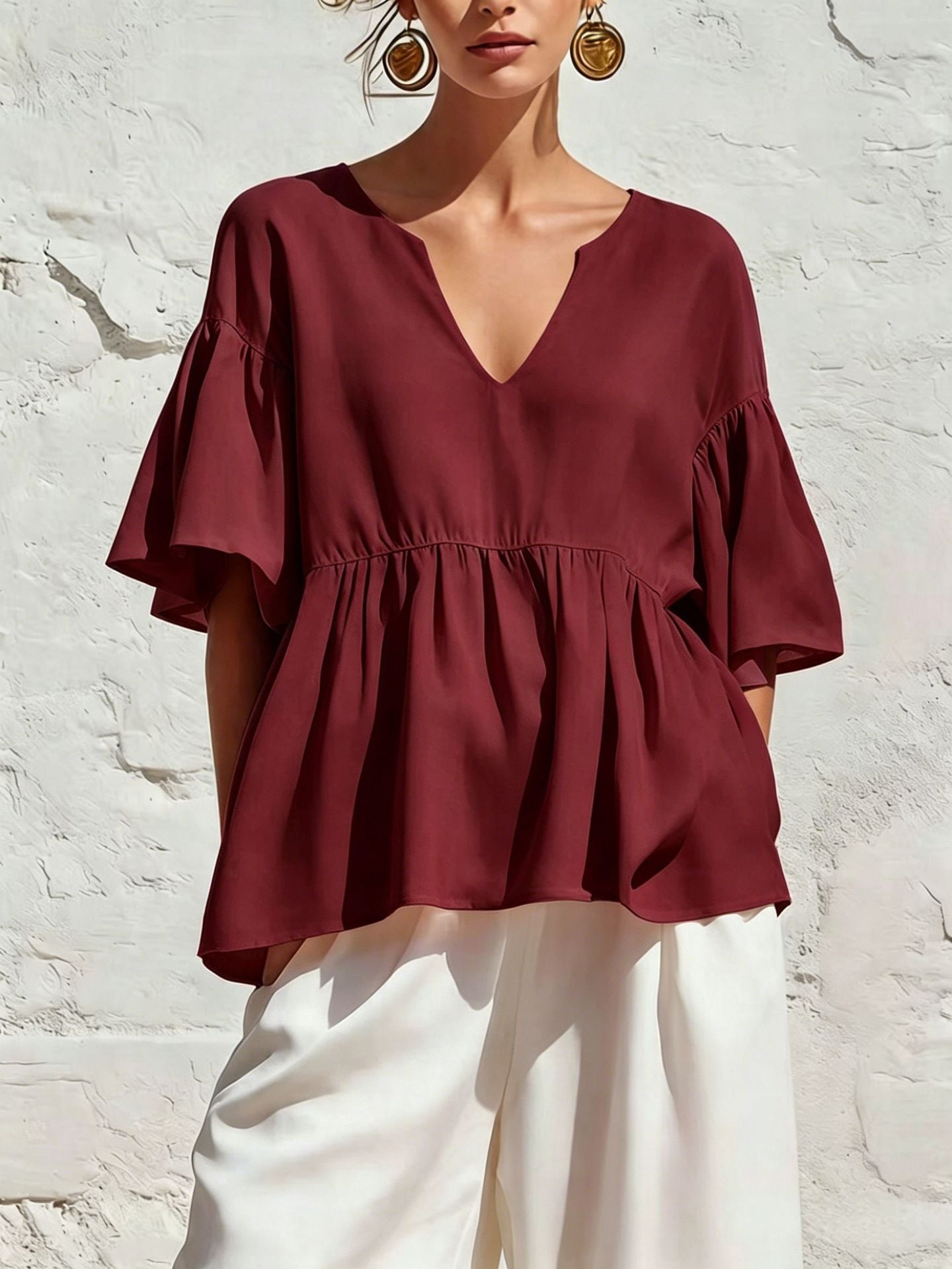 Relaxed Ruffle Hem Blouse with V-Neckline and Flutter Sleeves
